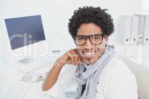 Hipster businessman working at his desk