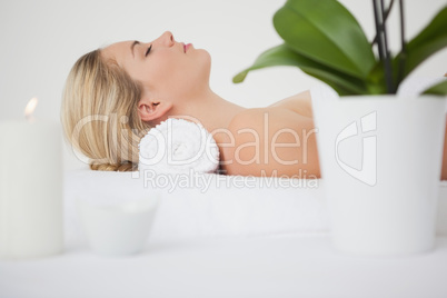 Beautiful blonde lying on massage table