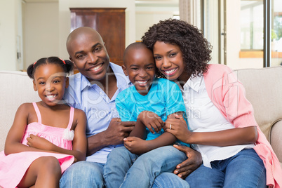 Happy family relaxing on the couch