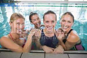 Female fitness class smiling at camera
