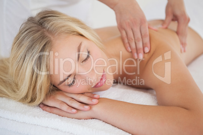 Pretty blonde enjoying a massage