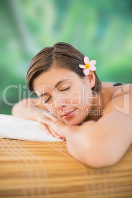 Beautiful young woman on massage table