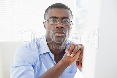 Thoughtful businessman looking at camera