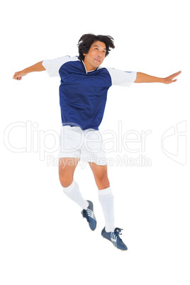 Football player in blue jumping