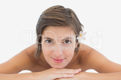 Close up portrait of a beautiful young woman on massage table