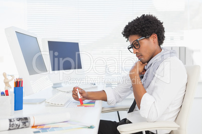 Hipster businessman working at his desk