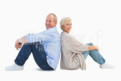 Happy mature couple smiling at camera