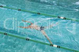 Fit swimmer training by himself