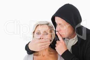 Older man silencing his fearful partner