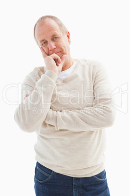 Thinking mature man with hand on chin