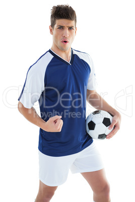 Football player in blue celebrating