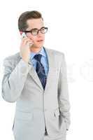 Geeky businessman talking on cellphone