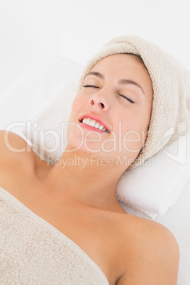 Close up of a beautiful young woman on massage table