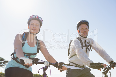 Active couple going for a bike ride in the countryside