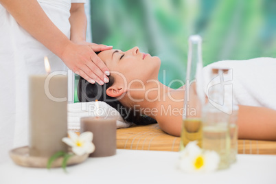 Beautiful brunette enjoying a head massage