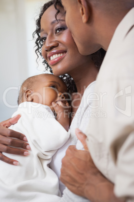 Happy parents spending time with baby