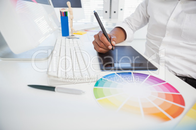 Designer working at desk using digitizer