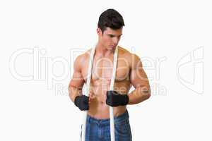 Serious shirtless young muscular man