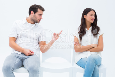 Man pleading with angry girlfriend