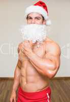 Bacho man with fake santa beard at the gym