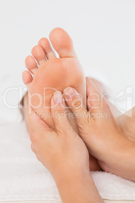 Close-up of a woman receiving foot massage