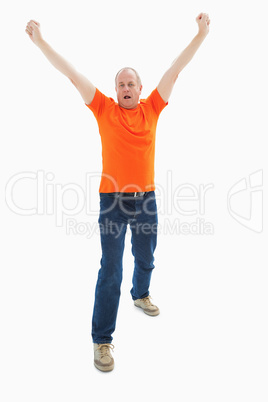 Mature man in orange tshirt cheering