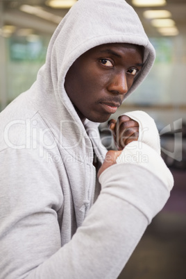Boxer in hood jacket at health club