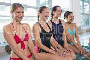 Female aqua aerobics class smiling