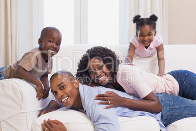 Happy family posing on the couch together