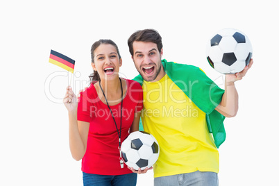 Football fan couple cheering and smiling at camera