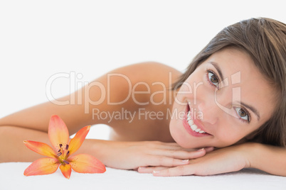 Close up portrait of a beautiful young woman on massage table