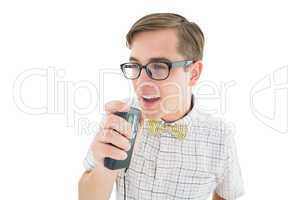 Geeky hipster speaking into dictaphone