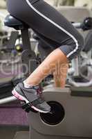 Fit woman working out on the exercise bike