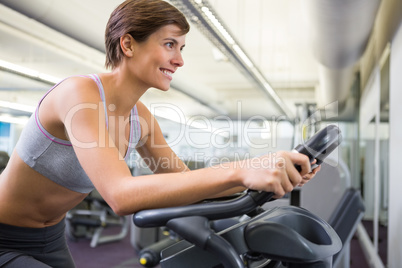 Fit woman working out on the exercise bike