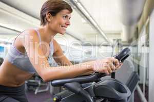 Fit woman working out on the exercise bike