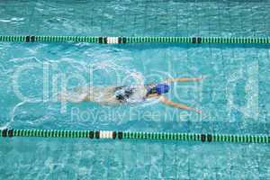 Fit swimmer training by herself