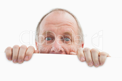 Mature man looking over card