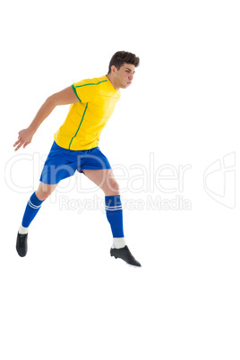 Football player in yellow jumping