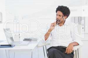 Hipster businessman working at his desk