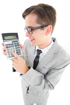 Geeky smiling businessman showing calculator