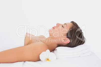 Side view of a beautiful woman on massage table