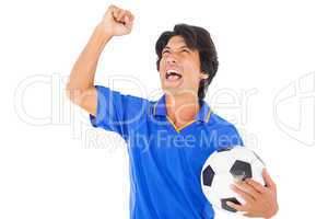 Football player in blue celebrating a victory