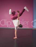 Cool break dancer doing handstand on one hand