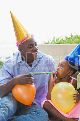 Father and children celebrating a birthday together