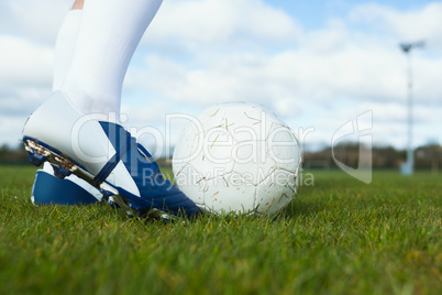 Football player about to kick ball