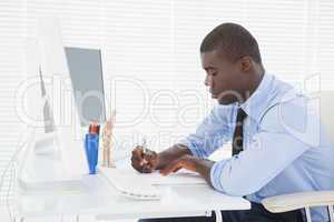 Handsome businessman working at his desk