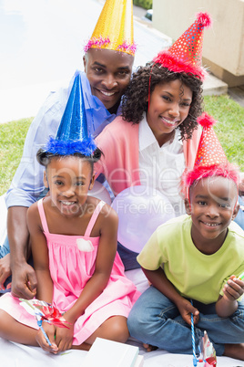 Happy family celebrating a birthday together in the garden