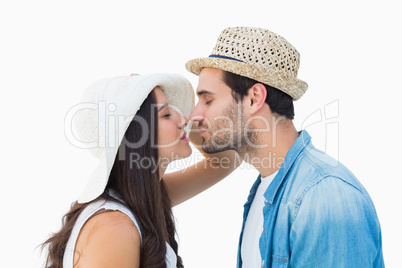 Happy hipster couple about to kiss