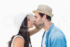 Happy hipster couple about to kiss