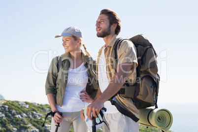 Hiking couple looking ahead at mountain summit